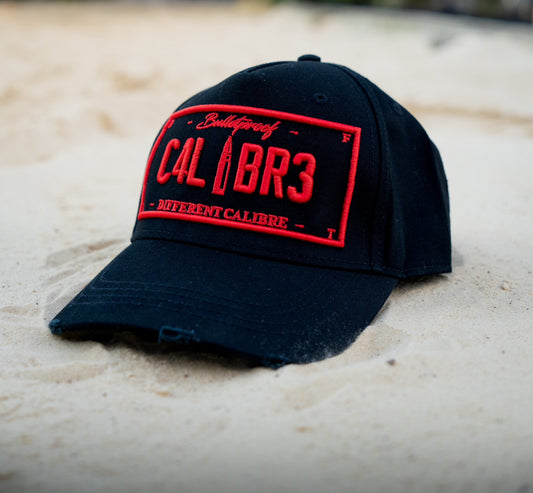 RED PLATED BLACK TRUCKER CAP